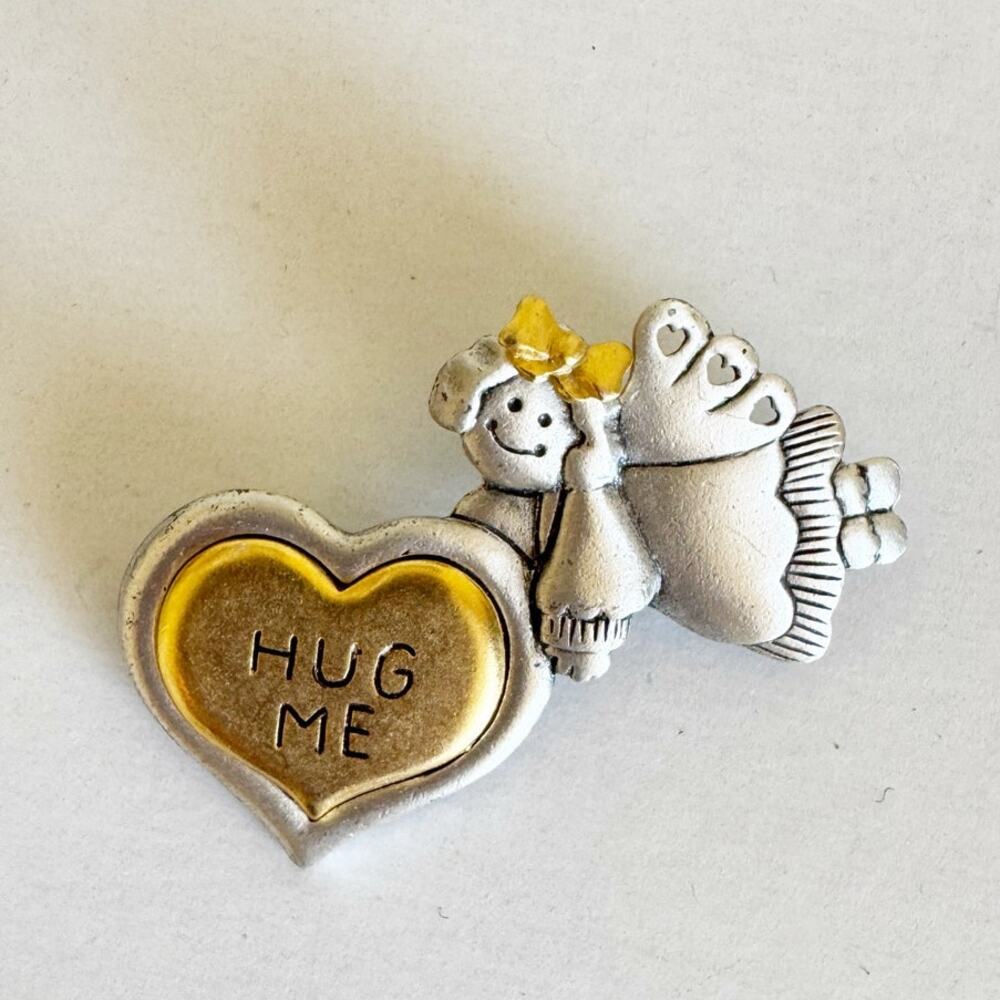 vintage AJMC "Hug Me" heart angel pin brooch in silver and gold tone metal